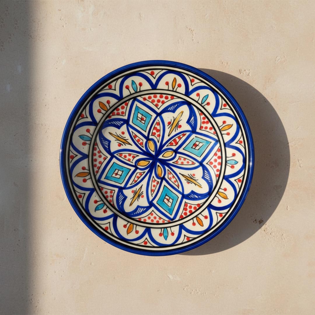 Handcrafted Moroccan ceramic serving plate with hand-painted blue and red pattern